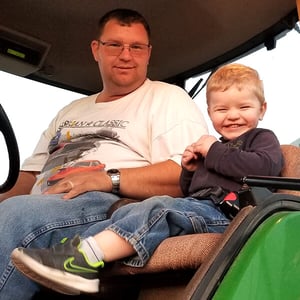AGirrit and Son in Tractor
